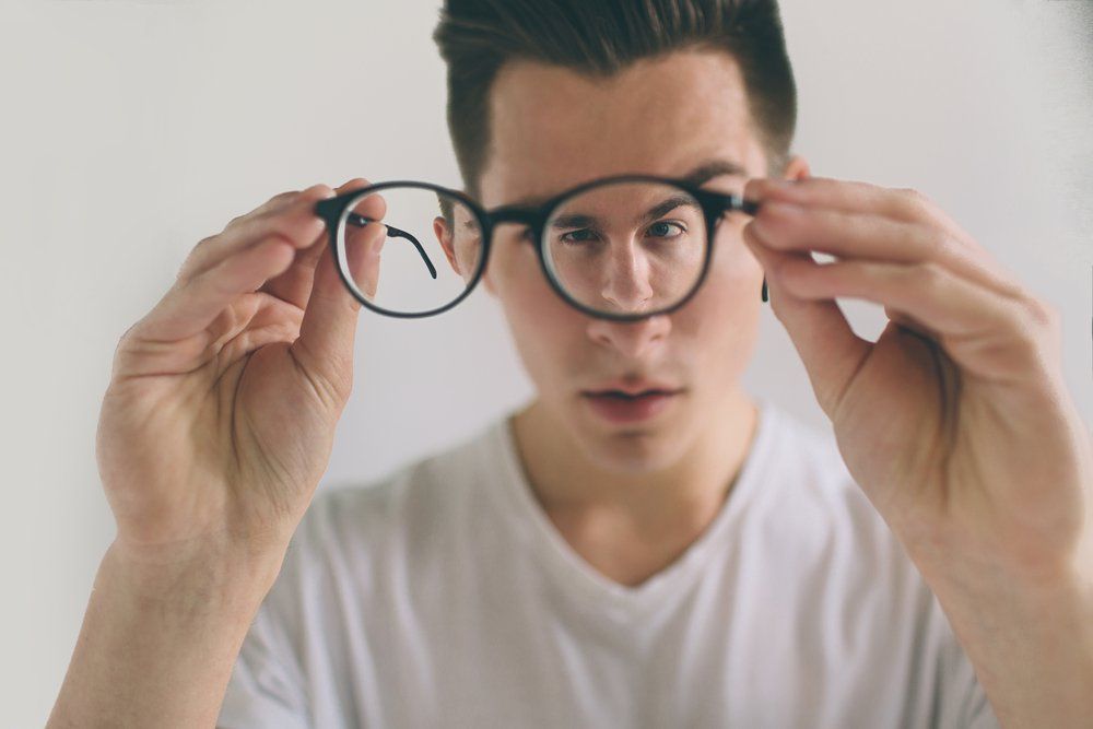 If you have nearsightedness and astigmatism, should you wear glasses regularly and how often do