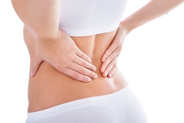Bị đau lưng dưới ngày rụng trứng | Vinmec