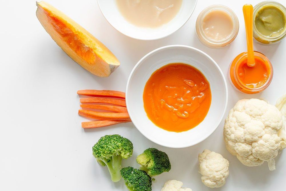 How much should an 8-month-old girl weigh, and how is it related to the nutrients needed in her solid food diet
