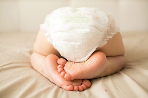 What diseases do bloody stools in infants warn about?