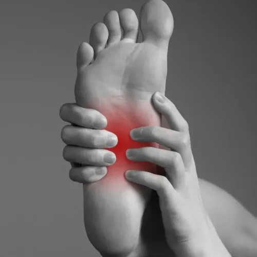 Why do you have pain in the middle of your foot?