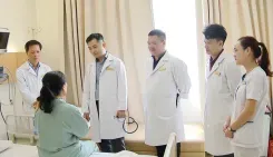 Cardiology Team Examines Post-Surgery Patient
